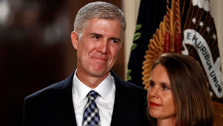 Judge Neil Gorsuch stands with his wife Louise.