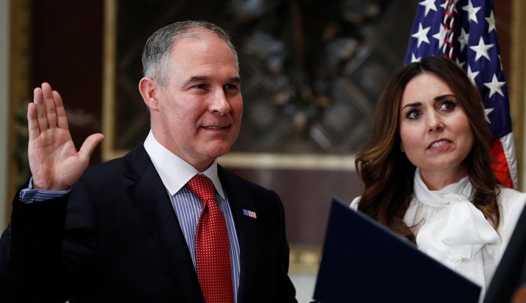 Scott Pruitt gets sworn-in as the Environmental Protection Agency Administrator. Holding the bible is his wife Marlyn Pruitt.