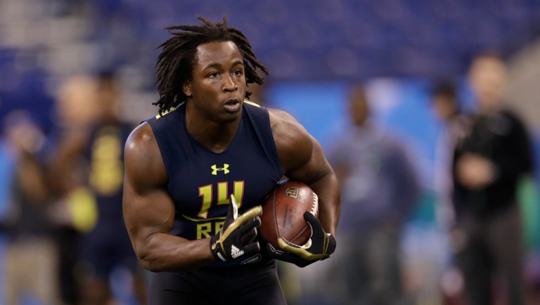 Toledo running back Kareem Hunt runs a drill at the NFL football scouting combine.