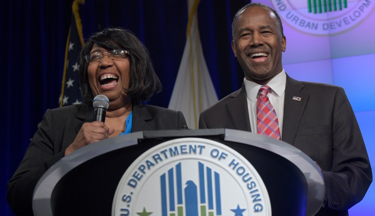 Housing a Urban Development Secretary Ben Carson shares a laugh with his wife Lacena "Candy" Carson as they are introduced to speak to HUD employees in Washington.