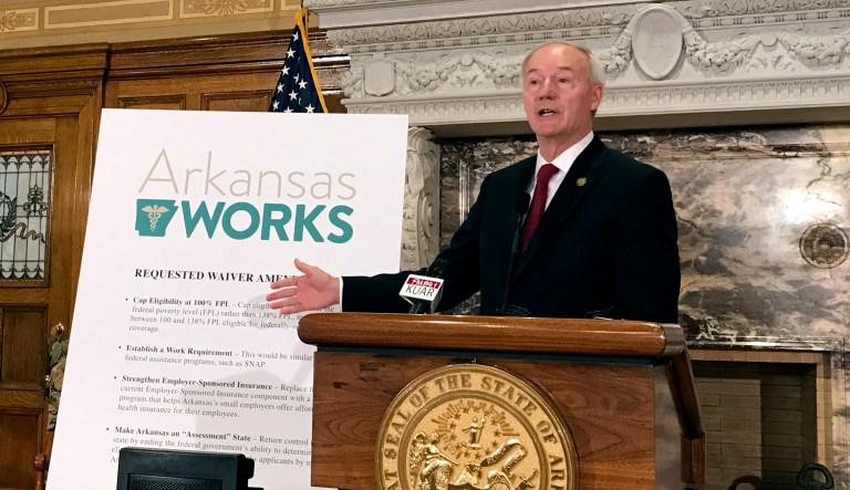 Arkansas Gov. Asa Hutchinson speaks during a news conference on Monday, March 6, 2017, in Little Rock, Ark.  Hutchinson said Monday that he wants to add a work requirement to Arkansas' hybrid Medicaid expansion and to lower its eligibility cap, which would add new restrictions to the program even as the future of the federal health overhaul remains unclear.