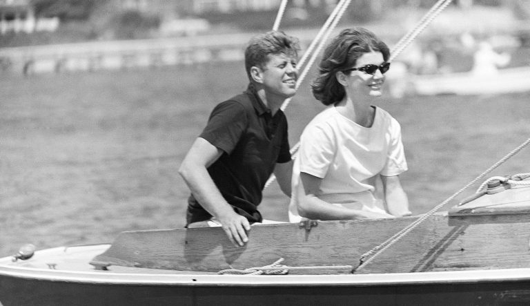 In this Aug. 7, 1960, photo, Sen. John F. Kennedy and wife Jacqueline sail in the family sailboat, Victura, off the Cape Cod shore at Hyannis, Massachusetts. 