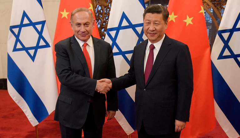 Israeli Prime Minister Benjamin Netanyahu and Chinese President Xi Jinping pose for photographers ahead of their talks in Beijing, China. 