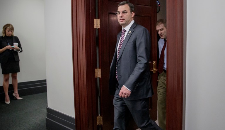Rep. Justin Amash, R-Mich., followed by Rep. Jim Jordan, R-Ohio, both members of the House Freedom Caucus whose conservative GOP members derailed the Republican health care bill last week, leave a closed-door strategy session with Speaker of the House Paul Ryan, R-Wis., and the leadership as they try to rebuild unity within the Republican Conference, at the Capitol, in Washington, Tuesday, March 28, 2017.