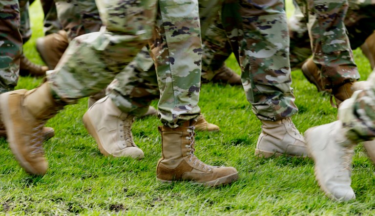 U.S. Army soldiers wear boots as they march in formation.