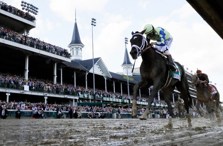 The breaks include tax cuts for activities as random as horse racing and Puerto Rican rum distilling. (AP Photo/David J. Phillip)