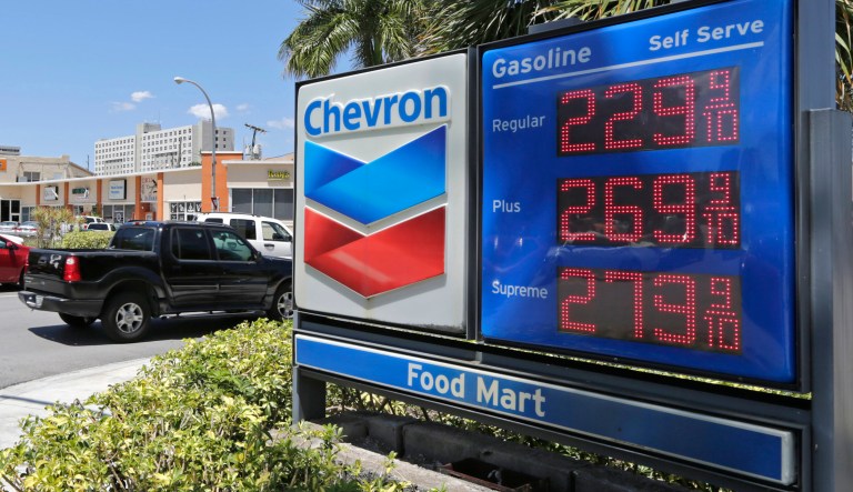In this Monday, May 15, 2017, photo, motorists pass a Chevron sign listing gas prices, in Miami Springs, Fla. On Friday, July 14, 2017, the  Labor Department reports on U.S. consumer prices for June.