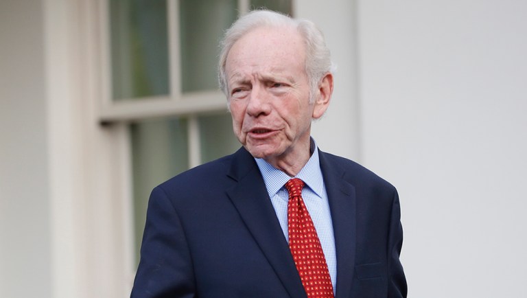 Former Connecticut Sen. Joe Lieberman leaves the West Wing of the White House in Washington.