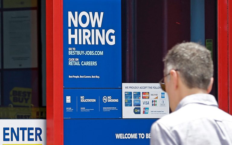 A "Now Hiring" sign welcomes a customer entering a Best Buy store in Hialeah, Fla. Gallup found that the public confidence in their personal finances is near a record high.  (AP Photo/Alan Diaz)