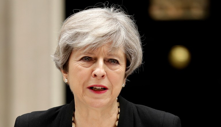 British Prime Minister Theresa May addresses the media outside 10 Downing Street in London.