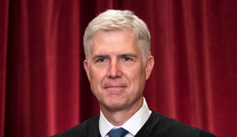 Associate Justice Neil Gorsuch joins other justices of the U.S. Supreme Court for an official group portrait at the Supreme Court Building in Washington, D.C.