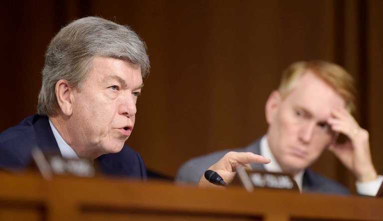 Sen. Roy Blunt, R-Mo., left, sitting next to Sen. James Lankford, R-Okla., right, asks a question during a hearing.