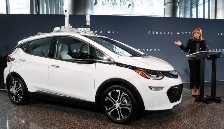 General Motors Chairman and CEO Mary Barra speaks next to an autonomous Chevrolet Bolt electric car, in Detroit.