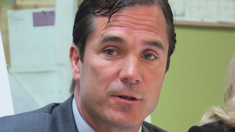 Nick Lyon, Michigan Health and Human Services director, speaks in support of the state's Medicaid expansion program in Lansing, Mich.