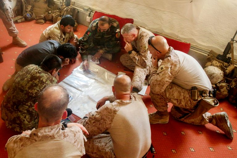 This June 13, 2017 photo released by Operation Resolute Support headquarters shows U.S. Marines with Task Force Southwest and Afghan National Army soldiers with the 215th Corps planning for the continuation of offensive combat operations at Camp Hanson, Afghanistan. Sixteen years into its longest war, the United States is sending another 4,000 troops to Afghanistan in an attempt to turn around a conflict characterized by some of the worst violence since the Taliban were ousted in 2001. They are also facing the emergence of an Islamic State group affiliate and an emboldened Taliban, who by Washingtonâs own watchdogâs assessment now control nearly half of Afghanistan. (U.S. Marine Corps photo by Sgt. Lucas Hopkins, Operation Resolute Support headquarters via AP)
