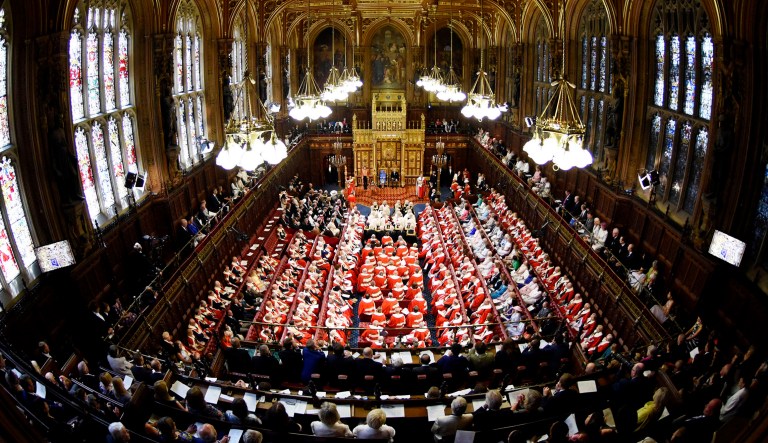Britain's Queen Elizabeth II and Prince Charles sit in the House of Lords at the official State Opening of Parliament in London.