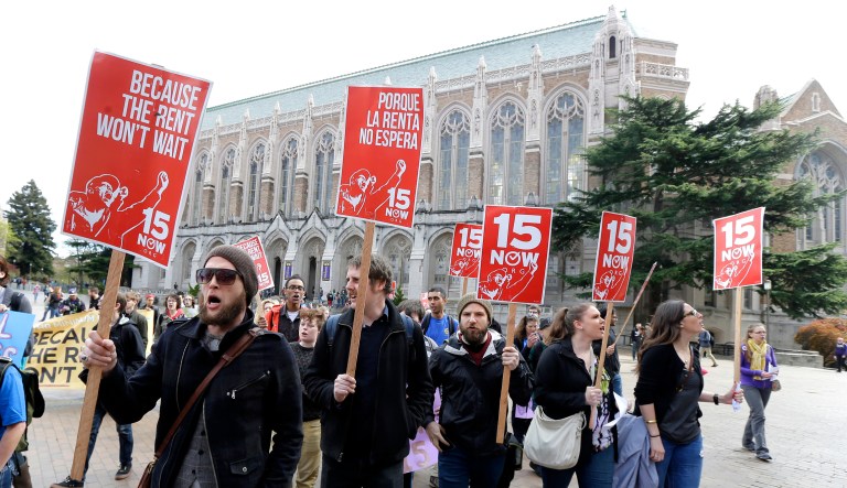 Students and other supporters protest on the University of Washington campus in Seattle on April 1, 2015, in support of raising the minimum wage for workers to $15 an hour.