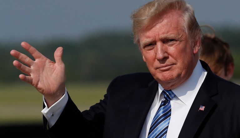 In this June 30, 2017, photo, President Donald Trump waves as he arrive on Air Force One at Morristown Municipal Airport, in Morristown, N.J. Trump will make remarks honoring veterans at a Kennedy Center event on July 1, hosted by an evangelical megachurch. Trump is spending the weekend at his golf club in Bedminster, New Jersey, but planned to briefly travel back to Washington on Saturday night for the âCelebrate Freedom Rallyâ at the John F. Kennedy Center for the Performing Arts.