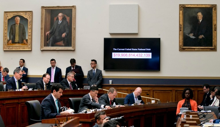 A "clock" representing increasing federal debt is projected on Capitol Hill in Washington in 2017.