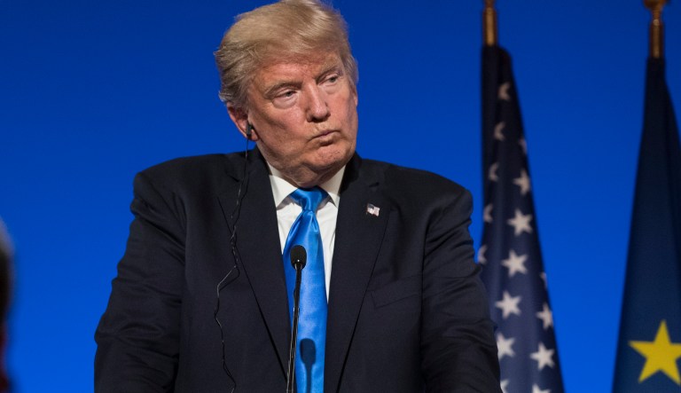 President Donald Trump pauses as he participates in a joint news conference with French President Emmanuel Macron at the Elysee Palace in Paris, Thursday, July 13, 2017.