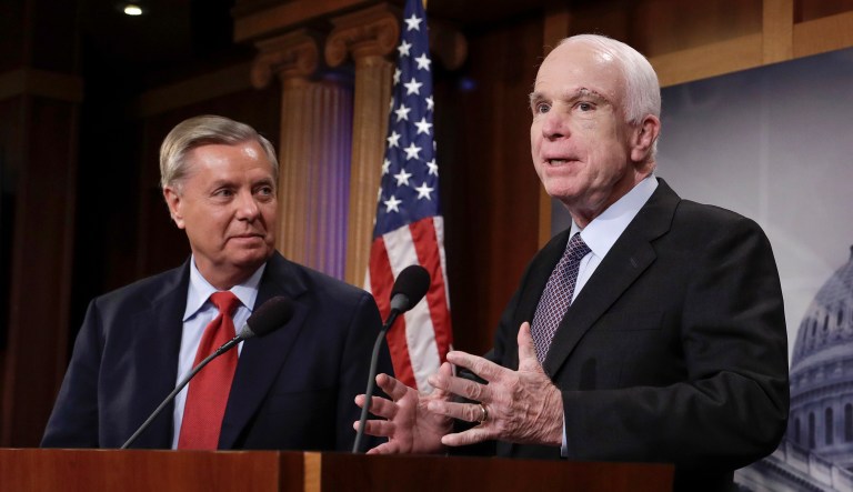 Sen. John McCain, R-Ariz., flanked by Sen. Lindsey Graham, R-S.C., (left) speaks to reporters.