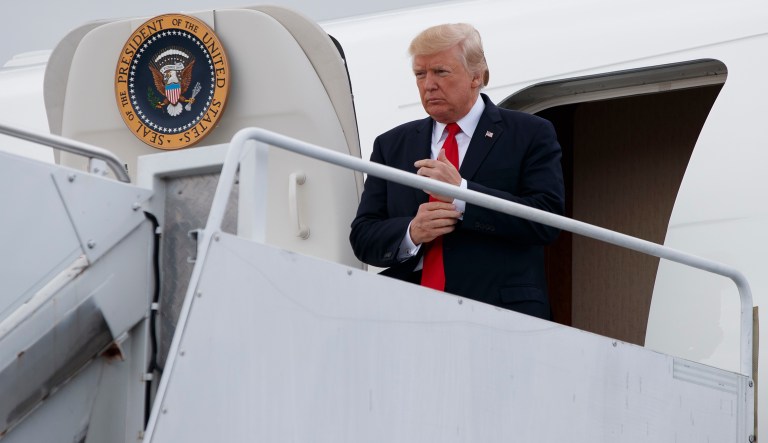 President Donald Trump steps off Air Force One after arriving at Long Island MacArthur Airport in Ronkonkoma, N.Y., Friday, July 28, 2017, to deliver a speech on the street gang MS-13.