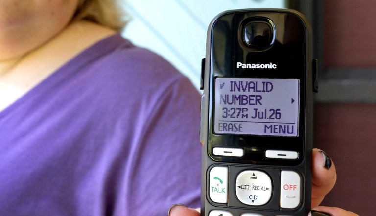 Jen Vargas shows the data of a recent robocall on her home phone in Orlando, Fla.