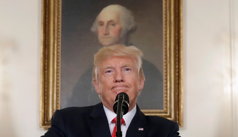 In this Aug. 14, 2017, photo, President Donald Trump pauses while speaking in the Diplomatic Reception Room of the White House in Washington.