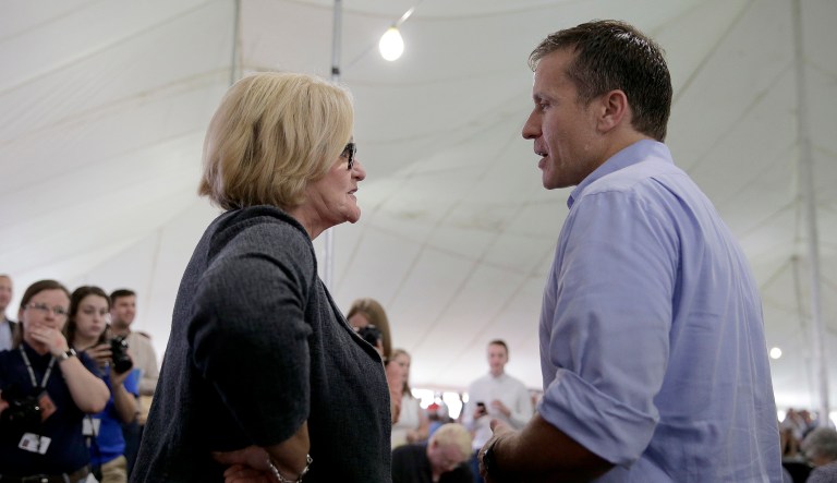 Missouri Gov. Eric Greitens talks with U.S. Sen. Claire McCaskill, D-Mo., during the Missouri State Fair. 