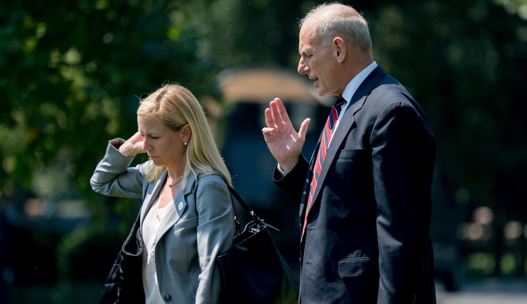 President Donald Trump's Chief of Staff John Kelly and President Donald Trump's Deputy Chief of Staff Kirstjen Nielsen speak together as they walk across the South Lawn to board Marine One at the White House in Washington, Tuesday, Aug. 22, 2017, for a short trip to Andrews Air Force Base, Md. and then onto Yuma, Ariz. to visit the U.S. border with Mexico and attend a rally in Phoenix with President Donald Trump.