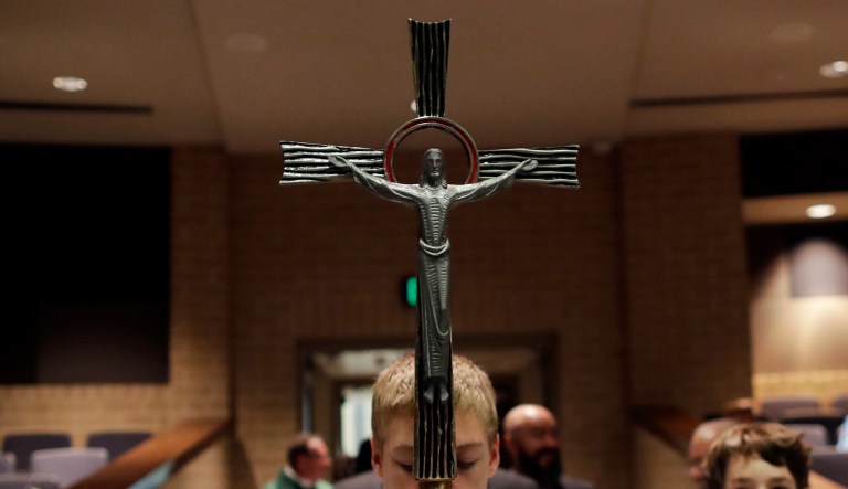 Altar servers prepare to start a Mass.