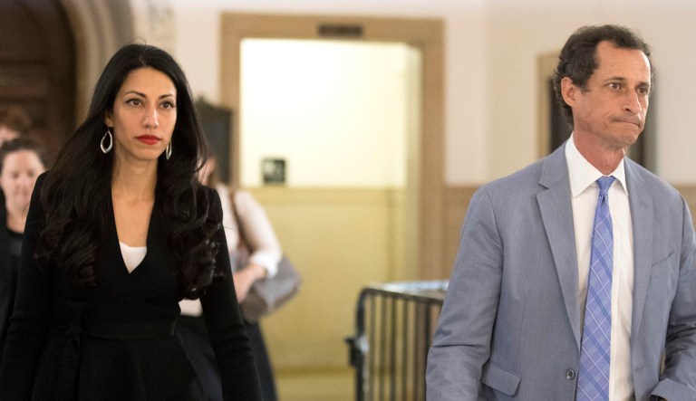 Former congressman Anthony Weiner, right, and his estranged wife, Huma Abedin, leave court in New York.