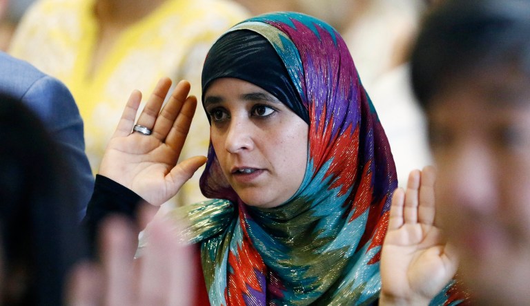 Nagat Abdulla Algalaby, formerly of Yemen, recites the Oath of Allegiance, at Northeast Jackson International Baccalaureate World Middle School in Jackson, Miss., on Sept. 18, 2017.