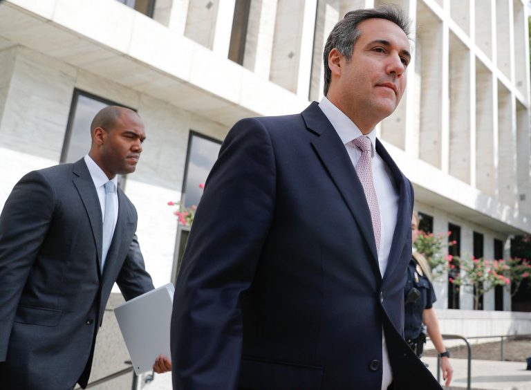 Michael Cohen, right, President Donald Trump's personal attorney, leaves Capitol Hill in Washington, Tuesday, Sept. 19, 2017. Cohen was appearing privately before the Senate Intelligence Committee.