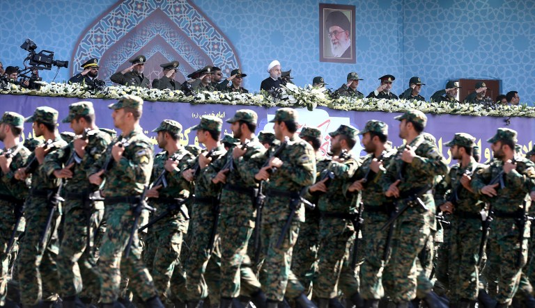 Iran's President Hassan Rouhani, top center, reviews army troops marching during the 37th anniversary of Iraq's 1980 invasion of Iran, in front of the shrine of the late revolutionary founder, Ayatollah Khomeini, just outside Tehran, Iran, Friday, Sept. 22, 2017. Iran's Revolutionary Guard has unveiled its latest ballistic missile with a range of 2,000 kilometers â about 1,250 milesâ capable of reaching much of the Middle East, including Israel.