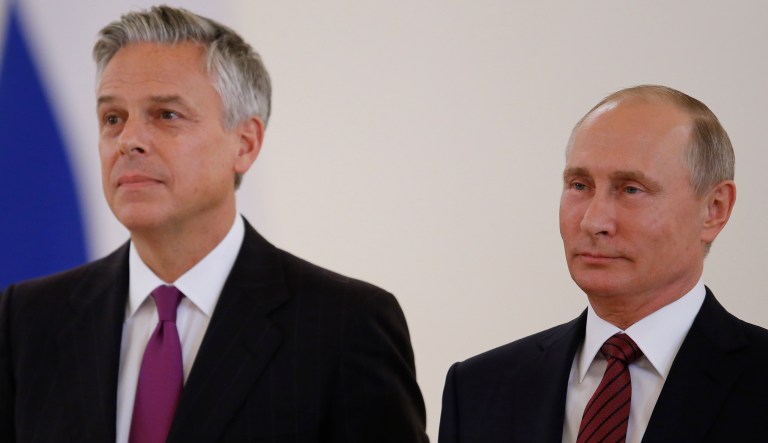 Russian President Vladimir Putin smiles receiving credentials from the U.S. Ambassador, Jon Huntsman during a ceremony in the Kremlin in Moscow on Oct. 3, 2017.