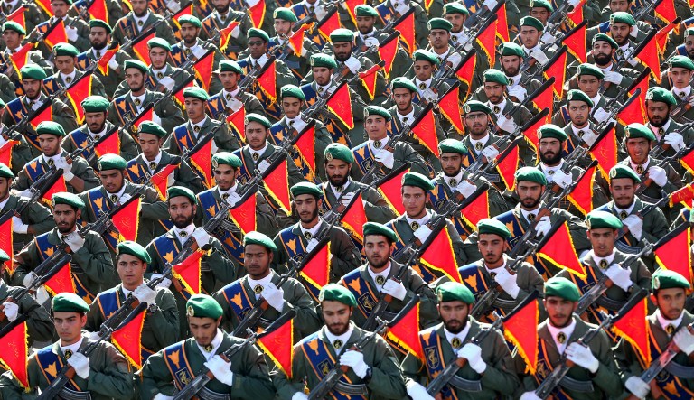 FILE - In this Sept. 21, 2016 file photo, Iran's Revolutionary Guard troops march in a military parade marking the 36th anniversary of Iraq's 1980 invasion of Iran, in front of the shrine of late revolutionary founder Ayatollah Khomeini, just outside Tehran, Iran. While U.S. President Donald Trump angered Iran with his speech on refusing to re-certify the nuclear deal, Tehran won't walk away from it in retaliation.