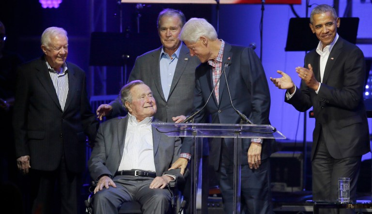 Former Presidents from right, Barack Obama, Bill Clinton, George W. Bush, George H.W. Bush and Jimmy Carter gather on stage during a hurricanes relief concert in College Station, Texas.