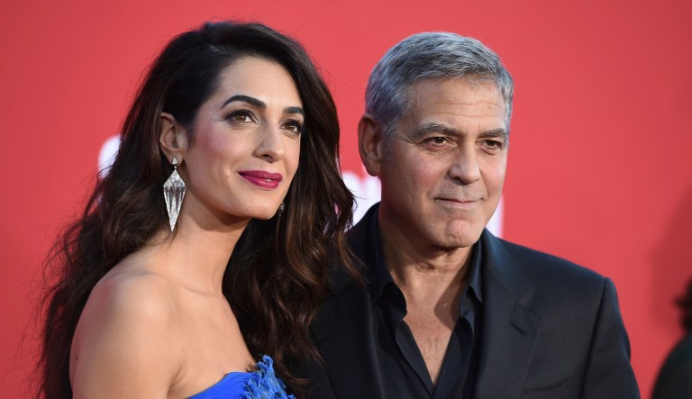 Amal Clooney and George Clooney arrive at the LA Premiere of "Suburbicon" at the Regency Village Theatre on Sunday, Oct. 22, 2017, in Los Angeles.