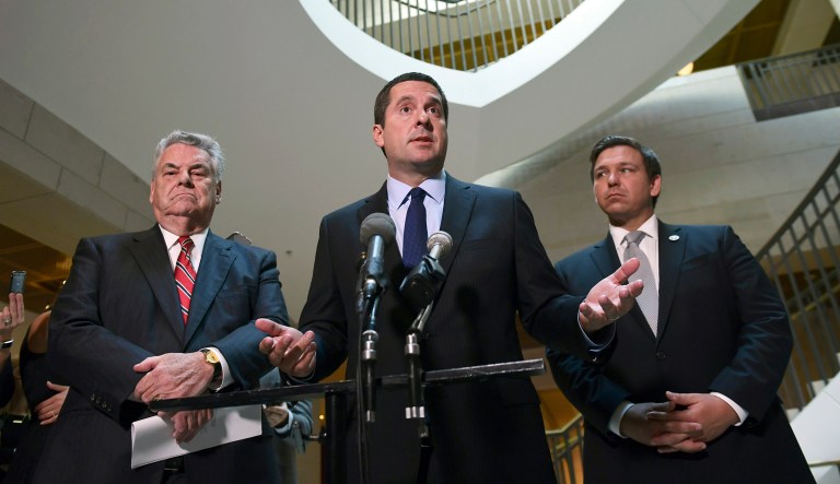 House Intelligence Committee Chairman Rep. Devin Nunes, R-Calif., standing with Rep. Peter King, R-N.Y., and Rep. Ron DeSantis, R-Fla., speaks on Capitol Hill in Washington. 