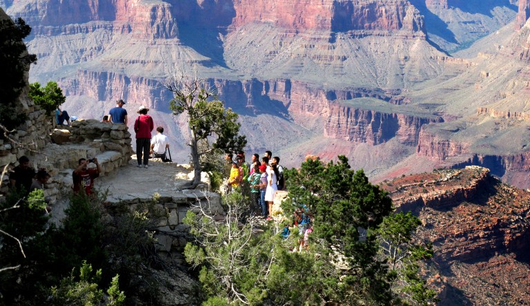 Visitors gather at an outlook on the South Rim of Grand Canyon National Park in northern Arizona.