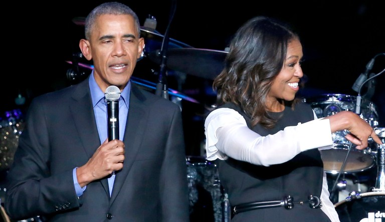 Former President Barack Obama, left, and Michelle Obama, center, praise Chance The Rapper during a community concert at the Obama Foundation Summit Wednesday, Nov. 1, 2017, in Chicago.
