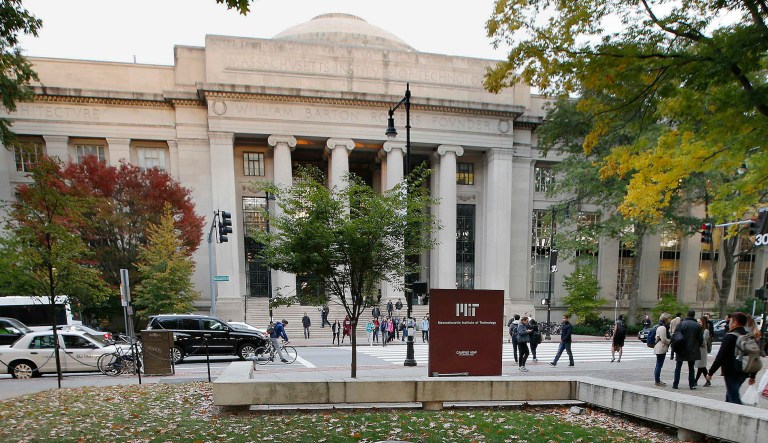 Students walk on the Massachusetts Institute of Technology campus in Cambridge, Massachusetts.