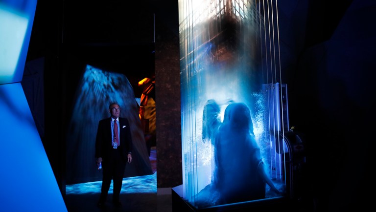 Cary Summers, president of the Museum of the Bible, walks through an exhibit at the museum.