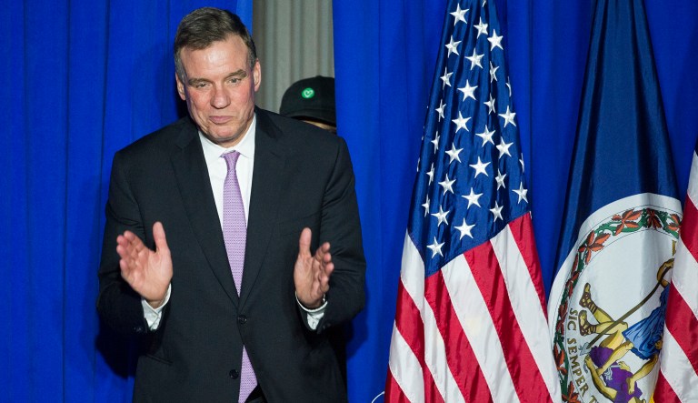 Senate Intelligence Committee Vice Chairman Sen. Mark Warner, D-Va., walks onstage to address the Ralph Northam For Governor election night party at George Mason University in Fairfax, Va., Tuesday, Nov. 7, 2017.