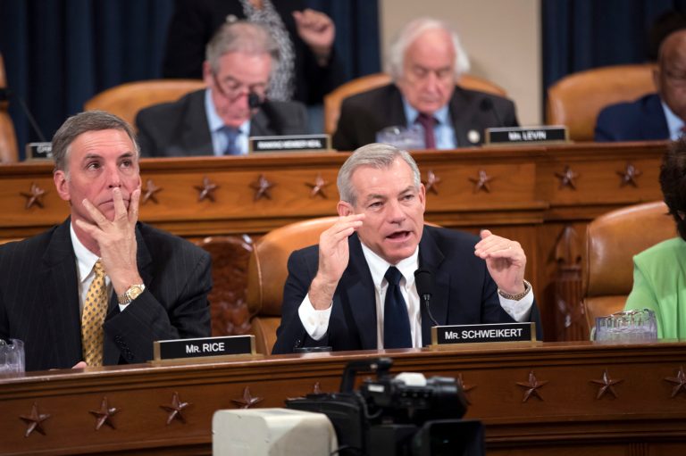 Rep. David Schweikert, R-Ariz., joined at left by Rep. Tom Rice, R-S.C., makes a point as the House Ways and Means Committee continues its debate over the Republican tax reform package, on Capitol Hill in Washington, Wednesday, Nov. 8, 2017.