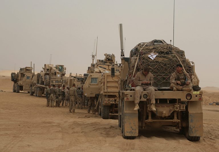 In this Tuesday, Nov. 7, 2017 photo,  U.S. Marines prepares to build a military site in western Anbar, Iraq.