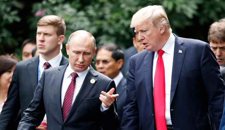 President Trump, center right, and Russia's President Vladimir Putin, center left, talk during the APEC Summit in Vietnam.