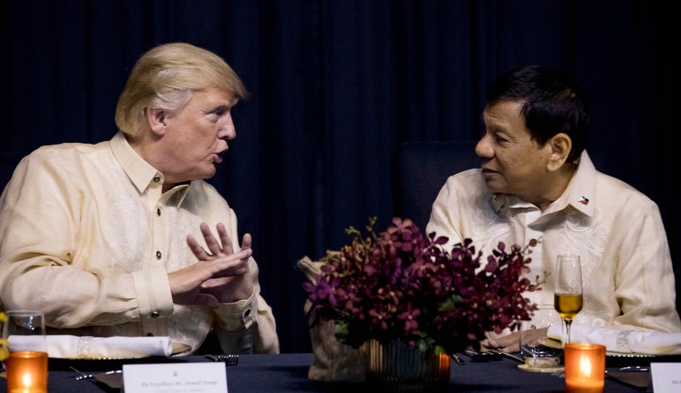 President Trump speaks with Philippine President Rodrigo Duterte, right, at an ASEAN Summit dinner at the SMX Convention Center in Manila, Philippines.