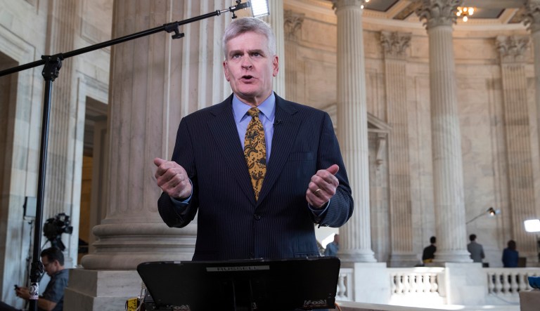 Sen. Bill Cassidy, R-La., talks during a television news interview. 